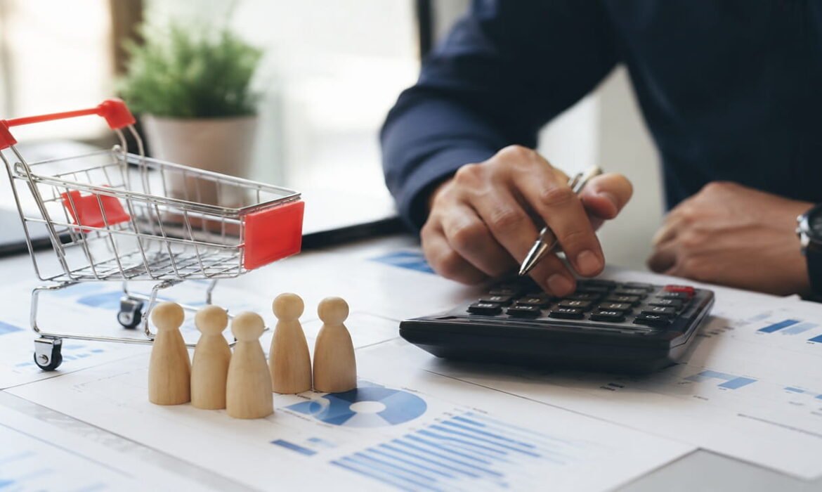 Business professional calculating Customer Acquisition Cost using financial reports, analytics dashboard, calculator, and customer acquisition data.